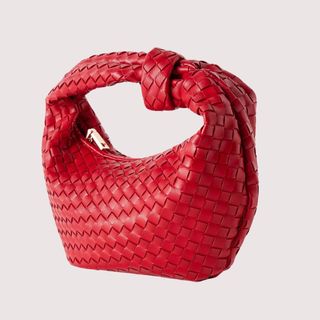 Flat lay image of red handbag 