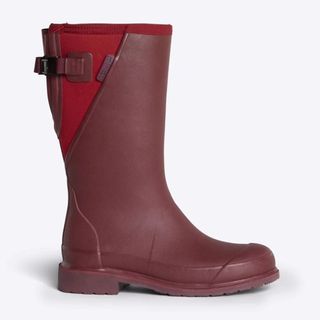 Cut out of a side view of a red Merry People Darcy wellington boot on a white background