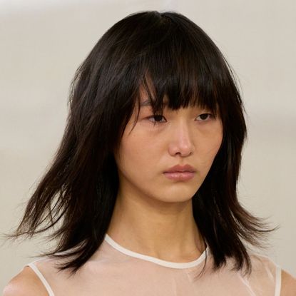 a model sporting a 'clavi-cut' on the runway for Aje