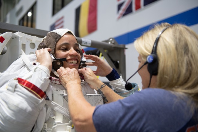 NASA astronaut Jessica Watkins puts on a spacesuit ahead of underwater training at NASA's Johnson Space Center in Houston.