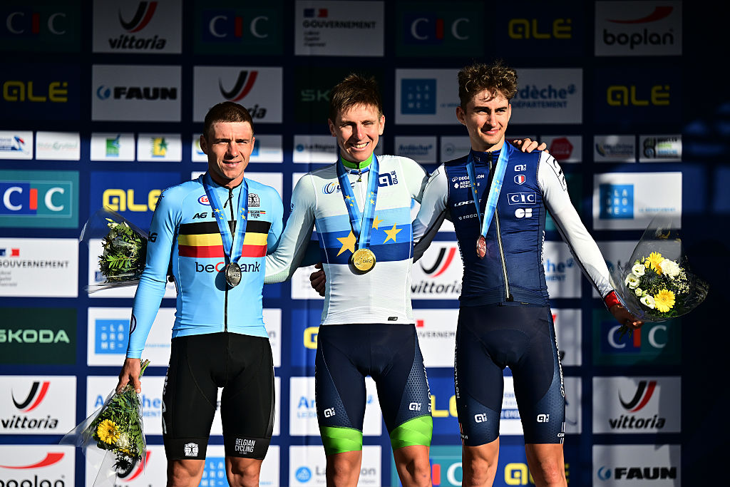 GUILHERAND-GRANGES, FRANCE - OCTOBER 05: Gold medalist Tadej Pogacar and Team Slovenia (C), Silver medalist Remco Evenepoel and Team Belgium (L) and Bronze medalist Paul Seixas and Team France (R) pose on the podium during the 31st UEC Road Cycling European Championships 2025 - Men&amp;amp;apos;s Elite Road Race a 202.5km race from Privas to Guilherand-Granges on October 05, 2025 in Guilherand-Granges, France. (Photo by Billy Ceusters/Getty Images)