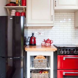 kitchen with fridge and white drawers