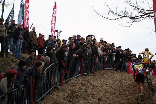 The very partisan crowd goes mad as Belgian Champion Bart Wellens pushes his bike up the steep dune