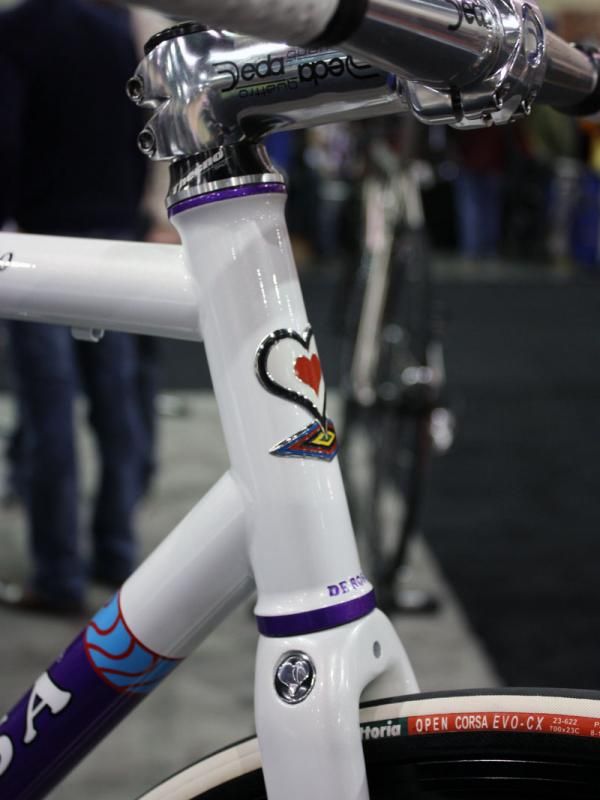 Purple accents contrast with the pearlescent white paint.