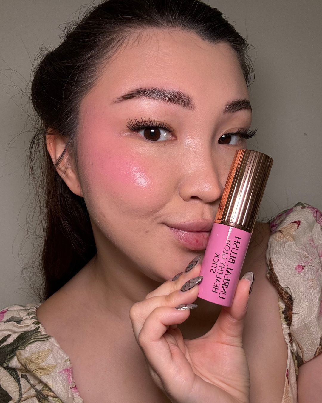 Denise Primbet testing the Charlotte Tilbury Unreal Blush Healthy Glow Stick