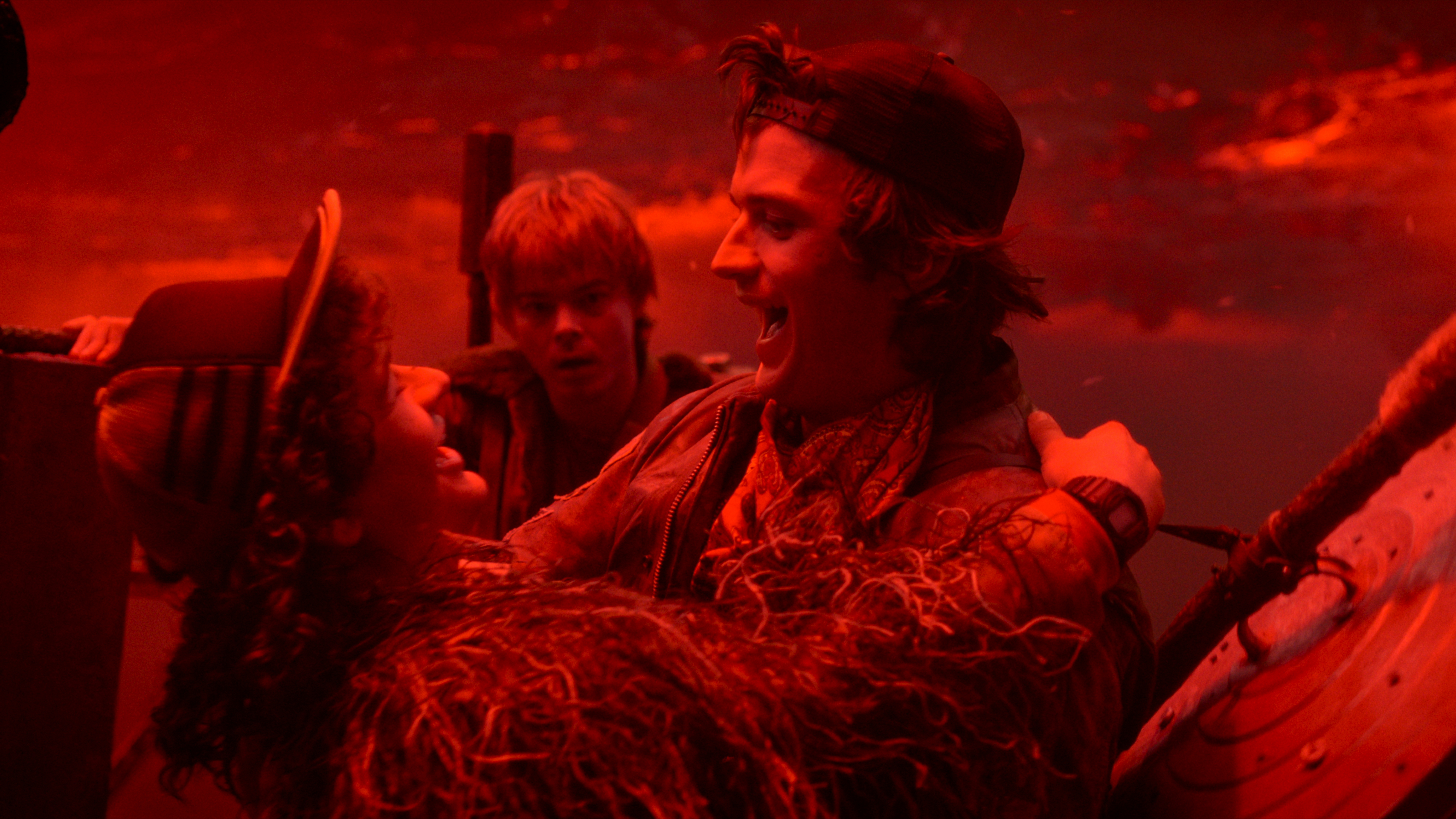 L-R: Dustin (Gaten Matarazzo), Jonathan (Charlie Heaton) and Steve (Joe Keery) celebrate in a scene from "Stranger Things" season 5 finale