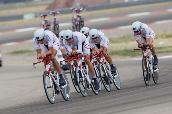 Competitive Cyclist rallies through one of the banked race track turns.