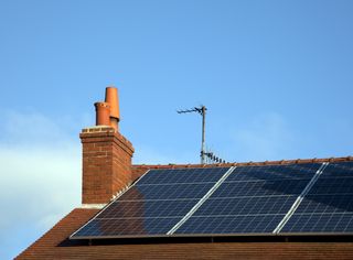 solar panels on roof of brick house
