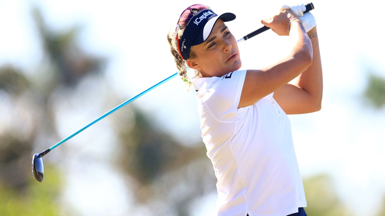 Lexi Thompson plays a fairway wood shot