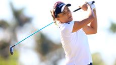 Lexi Thompson plays a fairway wood shot