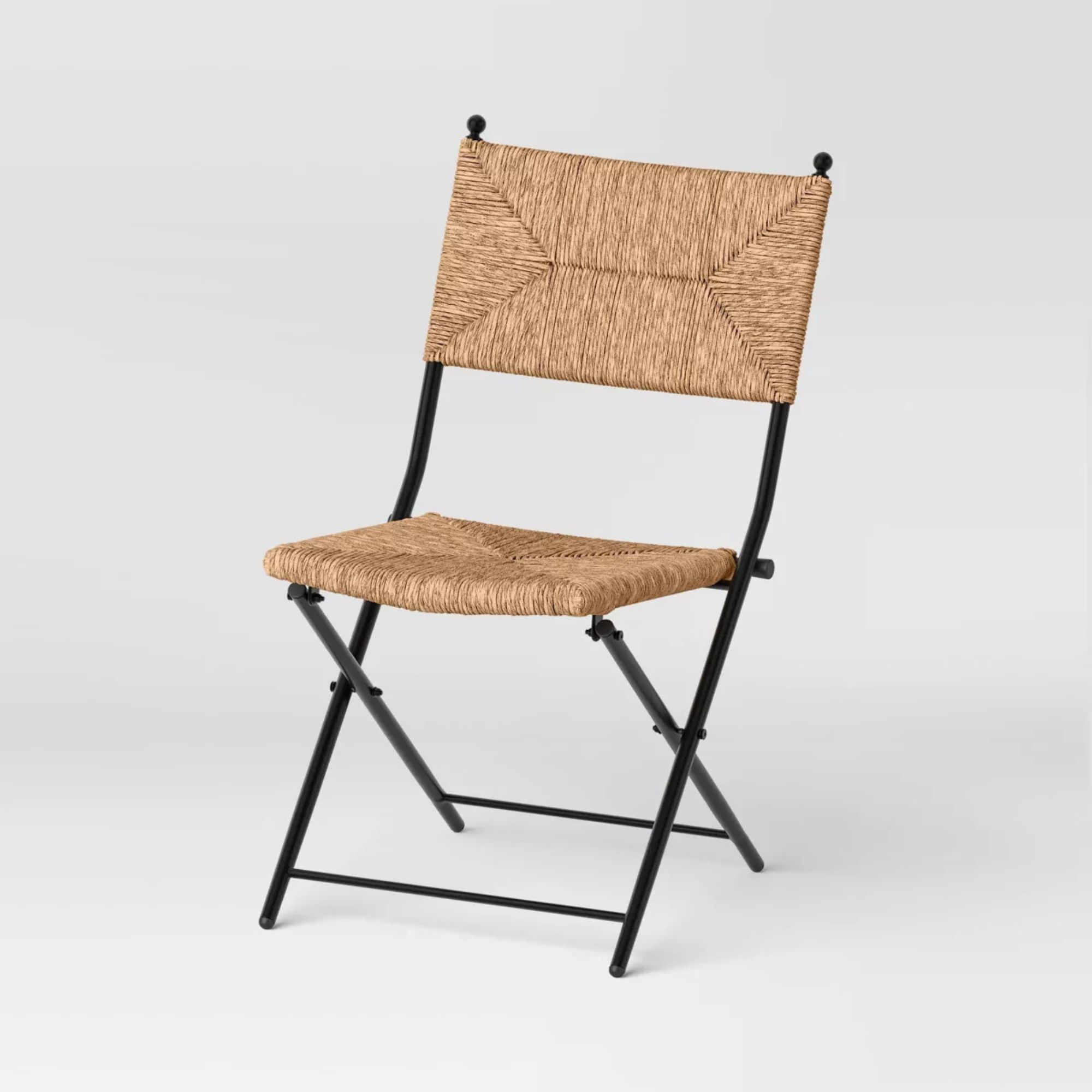 Wicker folding patio chair with black frame