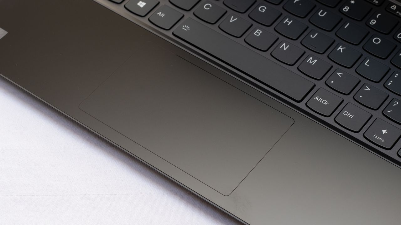 A closeup of the touchpad of the Lenovo Yoga 9i 14in (Shadow Black)
