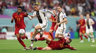 Spain and Germany players compete for the ball during their 1-1 draw at the 2022 World Cup in Qatar.