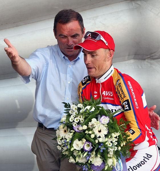 With a little help from Bernard Hinault Robbie Hunter finds the way around the podium.