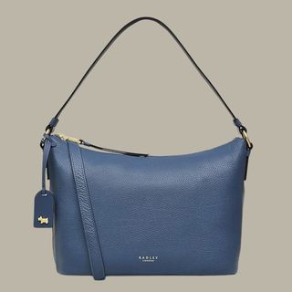 flat lay of medium blue Radley handbag