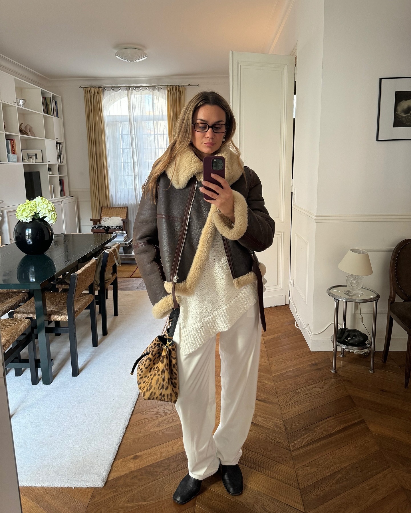 Fashion person Anna Laure Mais wears a london winter shoe trend. She wears black loafers.