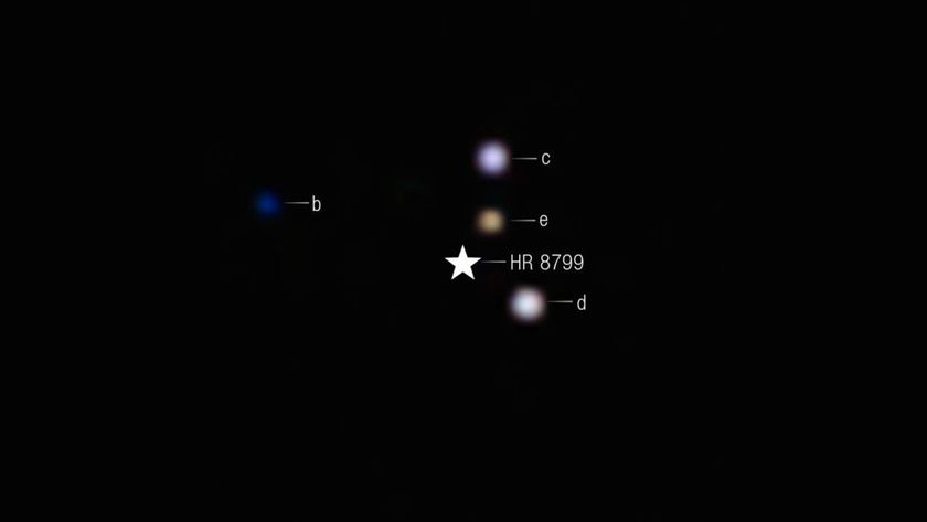 four puffy colored orbs around a star-shaped icon labelled hr 8799