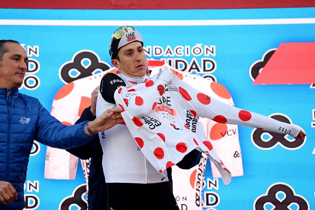 ALTEA SPAIN FEBRUARY 01 Marc Soler of Spain and UAE Team Emirates celebrates at podium as Polka dot Mountain Jersey during the 74th Volta a la Comunitat Valenciana 2023 Stage 1 a 1894km stage from Orihuela to Altea VCV2023 VoltaValenciana on February 01 2023 in Altea Spain Photo by Dario BelingheriGetty Images