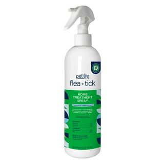  white plastic spray bottle of flea and tick spray with a green label