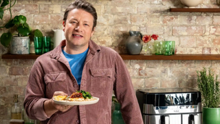 Jamie Oliver presenting a prosciutto baked fish dish cooked in his new TV show, 'Jamie's Air Fryer Meals'.