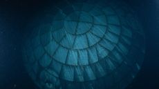A close up of a circular heat shield made of interlocking rectangular components seen underwater.