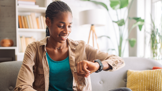 Woman looking at her smartwatch