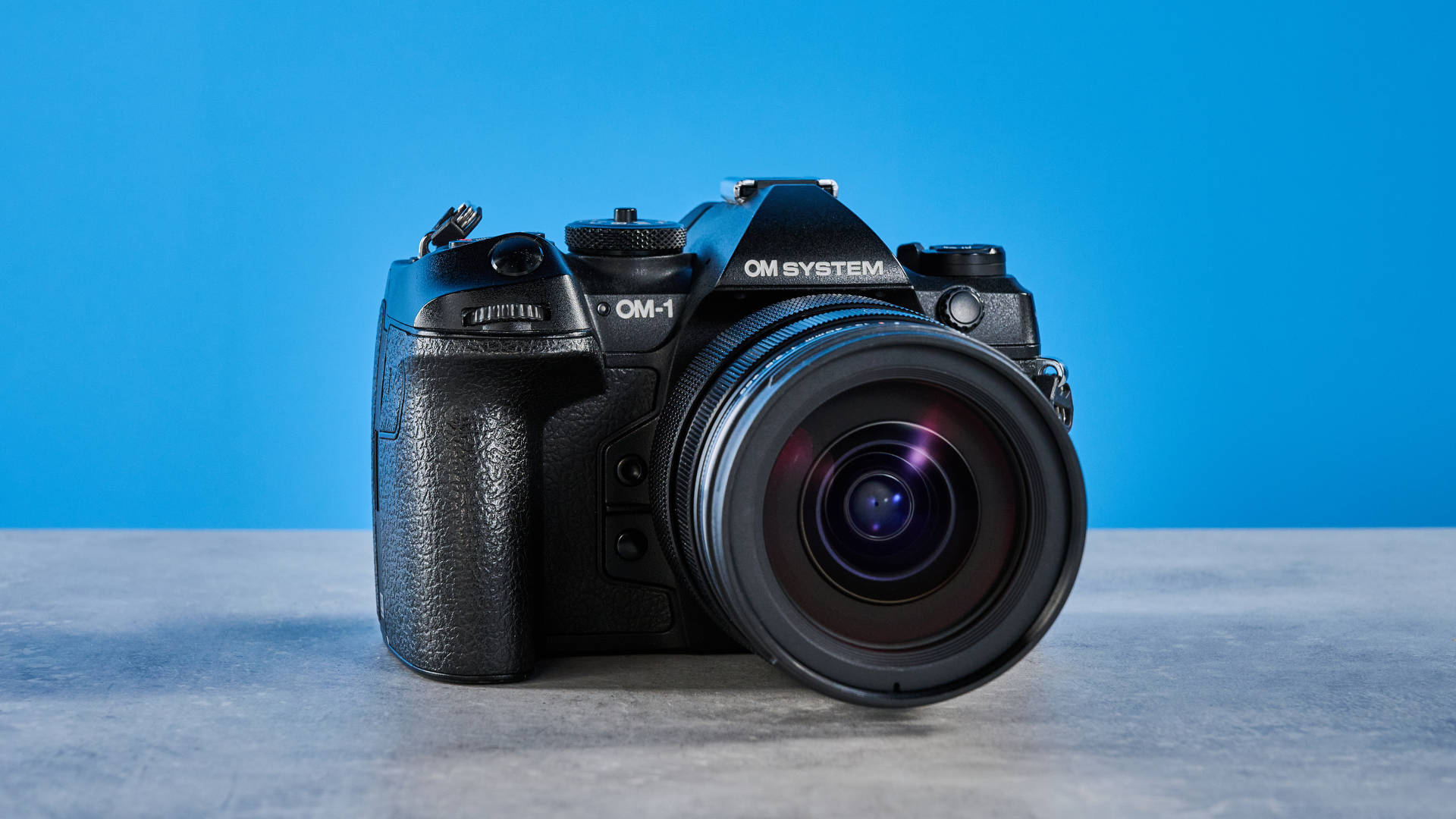 A black OM System OM-1 Mark II Micro Four Thirds mirrorless camera