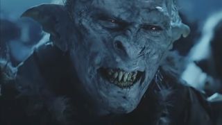 An Orc wears a creepy grin during a night scene in The Lord of the Rings: The Two Towers.