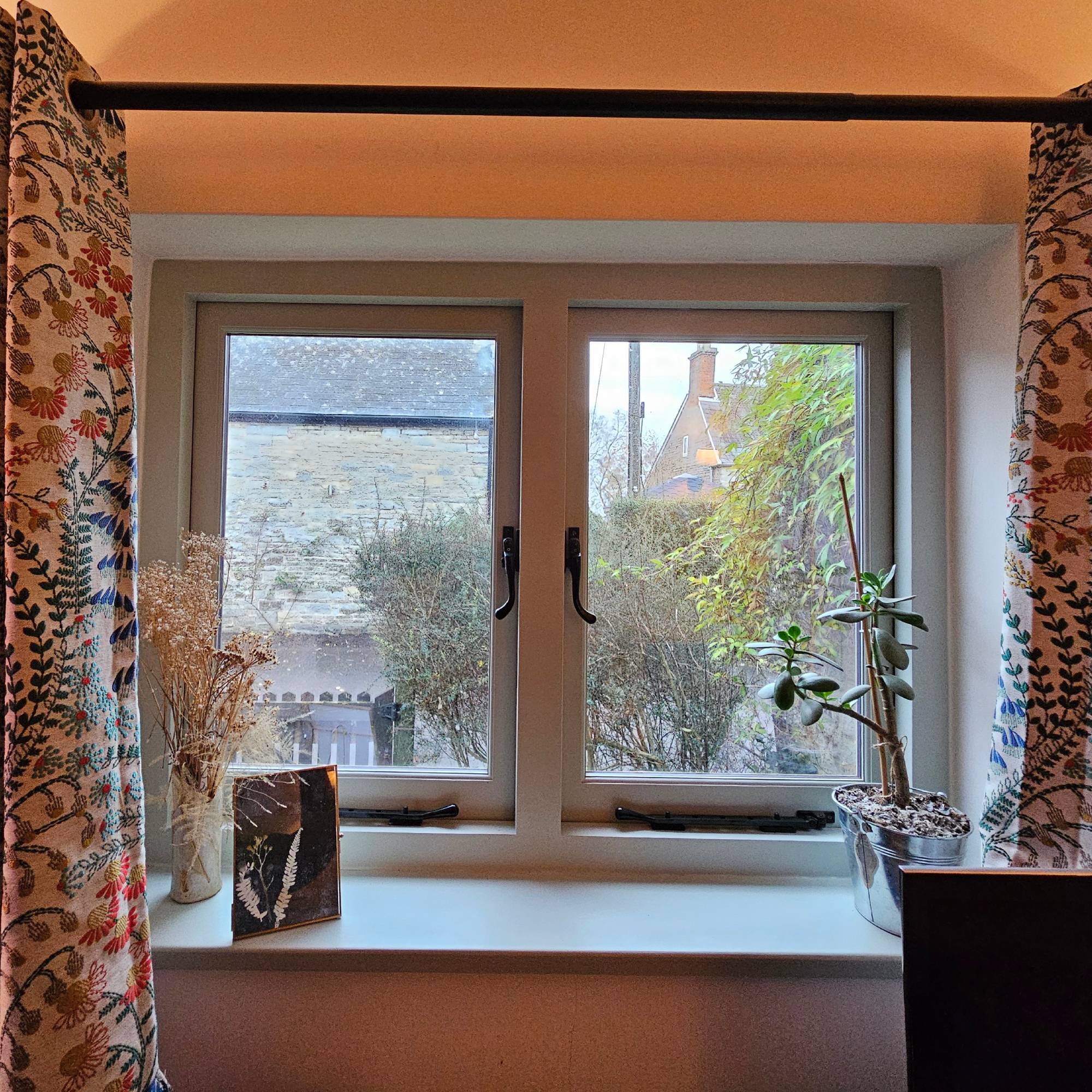 new light blue windows with flower curtains