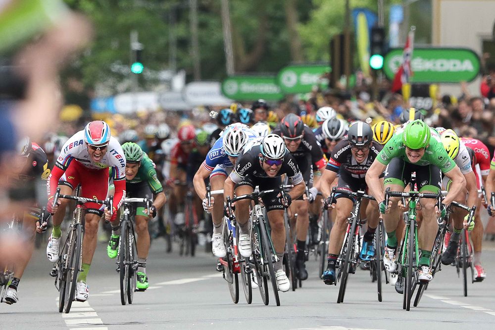 Andre Greipel surges past Mark Cavendish to win stage 5 of the 2015 Tour de France.