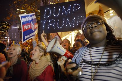 Demonstrators protest Donald Trump's appearance on NBC's "Saturday Night Live"