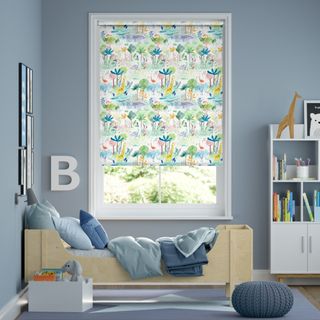 Safari themed patterned blind on window in blue and grey nursery