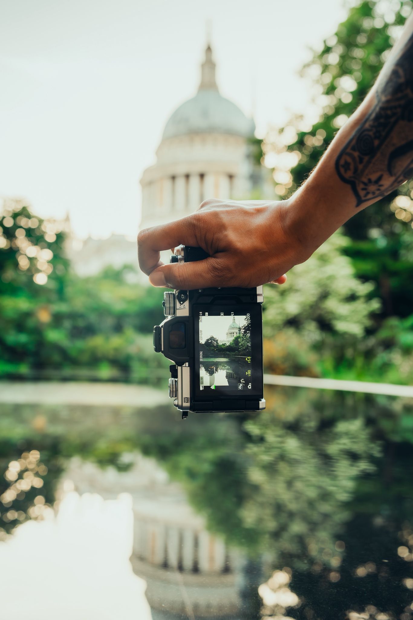 OM System OM-3 being held by a photographer