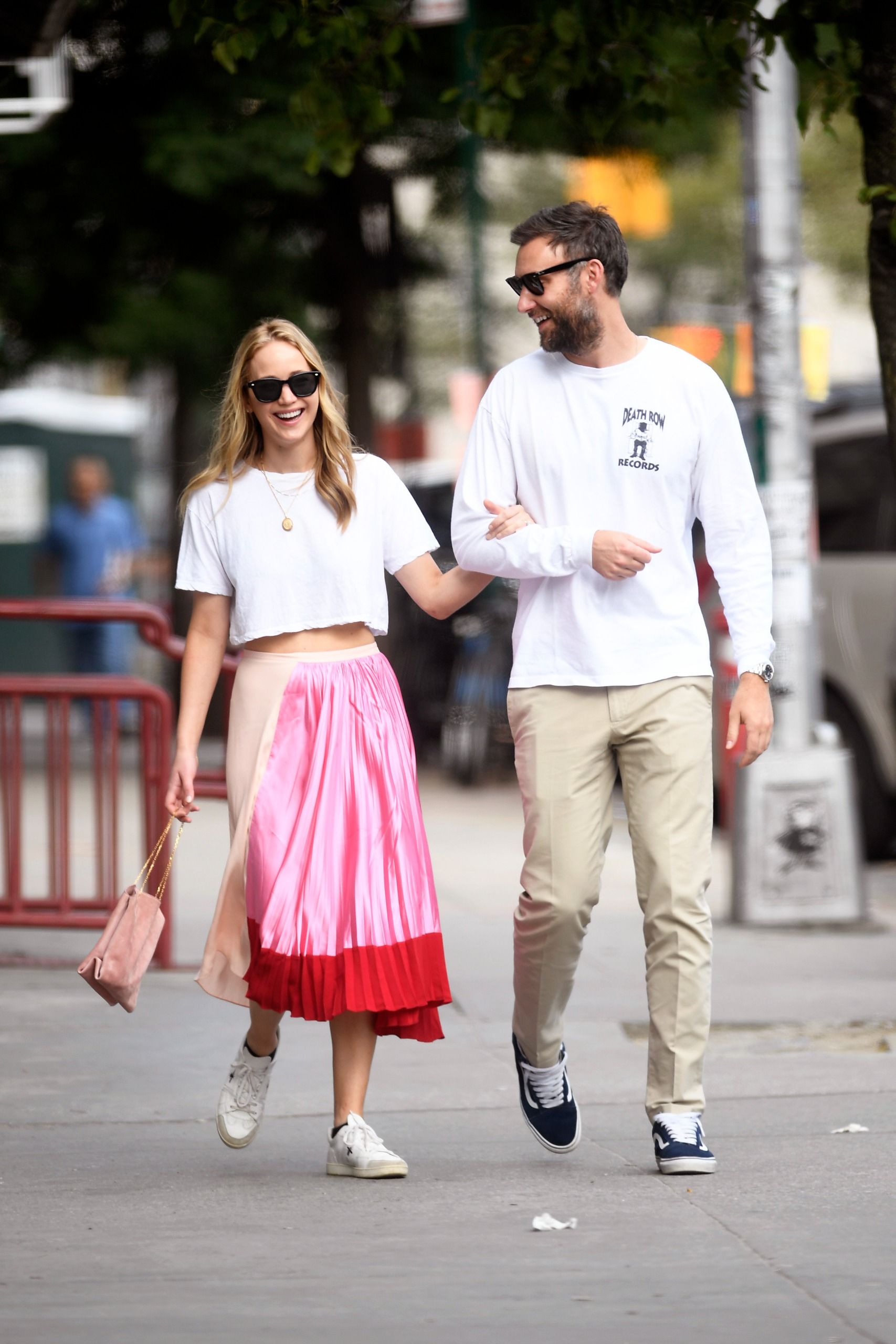 Jennifer Lawrence wore a white T-shirt and a multi-color skirt with white Dior sneakers in 2019