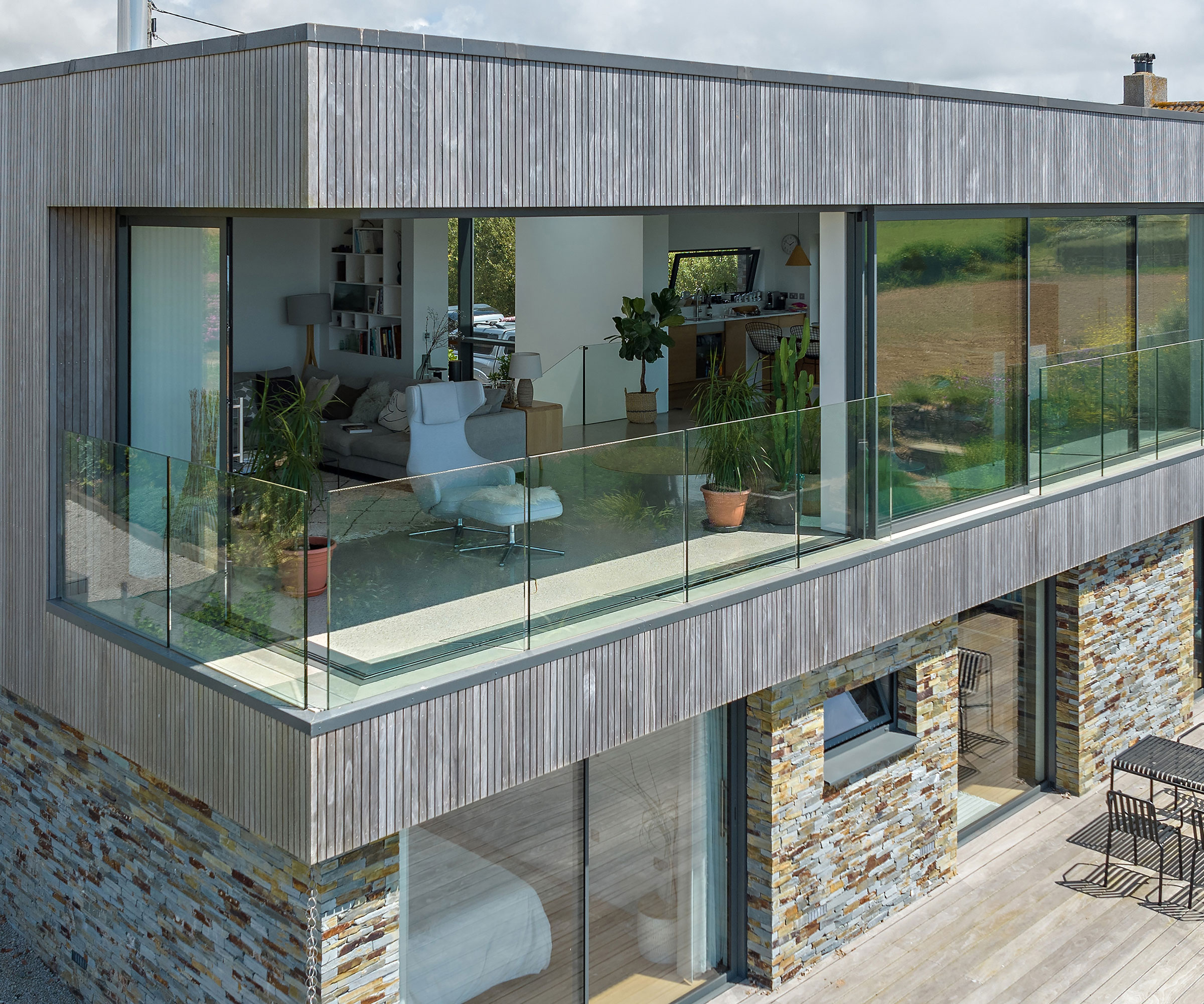 modern house with vertical timber cladding and sliding doors