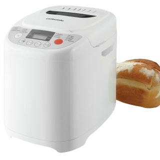 Cookworks Breadmaker in white with a loaf of bread next to it