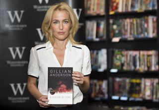 Gillian Anderson signs copies of her new book, A Vision of Fire, at Waterstones bookshop in Piccadilly, London.