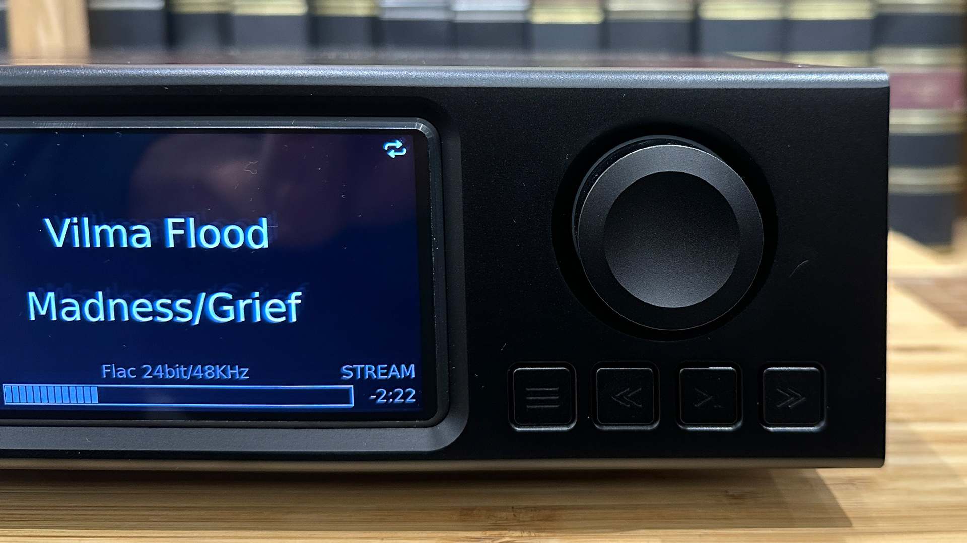 Aurender A1000 music streamer detail of volume control and screen showing Vilma Flood