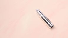 Silver bullet vibrator lying flat, representing how to use a bullet vibrator