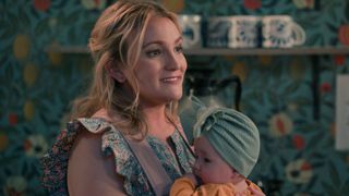 Jamie Lynn Spears as Noreen holding a baby in Sweet Magnolias season 3
