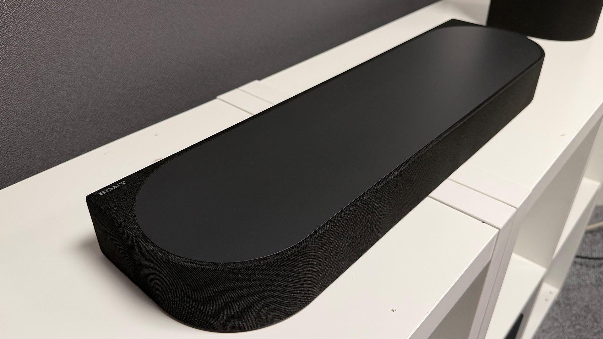 Sony Bravia Theatre Trio + Rear 9 and Sub 9 surround sound system on white shelving unit in test room, soundbar only