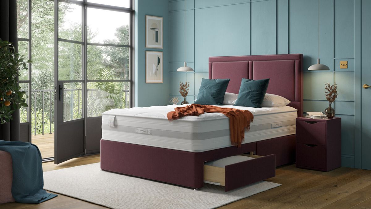 The Slumberland Response Latex Ultimate Mattress on a bed frame in a well decorated bedroom