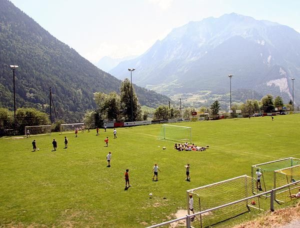 A high-altitude soccer game takes place on the penultimate Cat. 4 climb at Kirche, seemingly oblivious to the Tour de Suisse cycling race about to pass through.