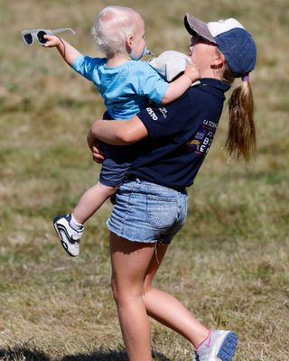 Mia Tindall swings around baby brother Lucas Tindall