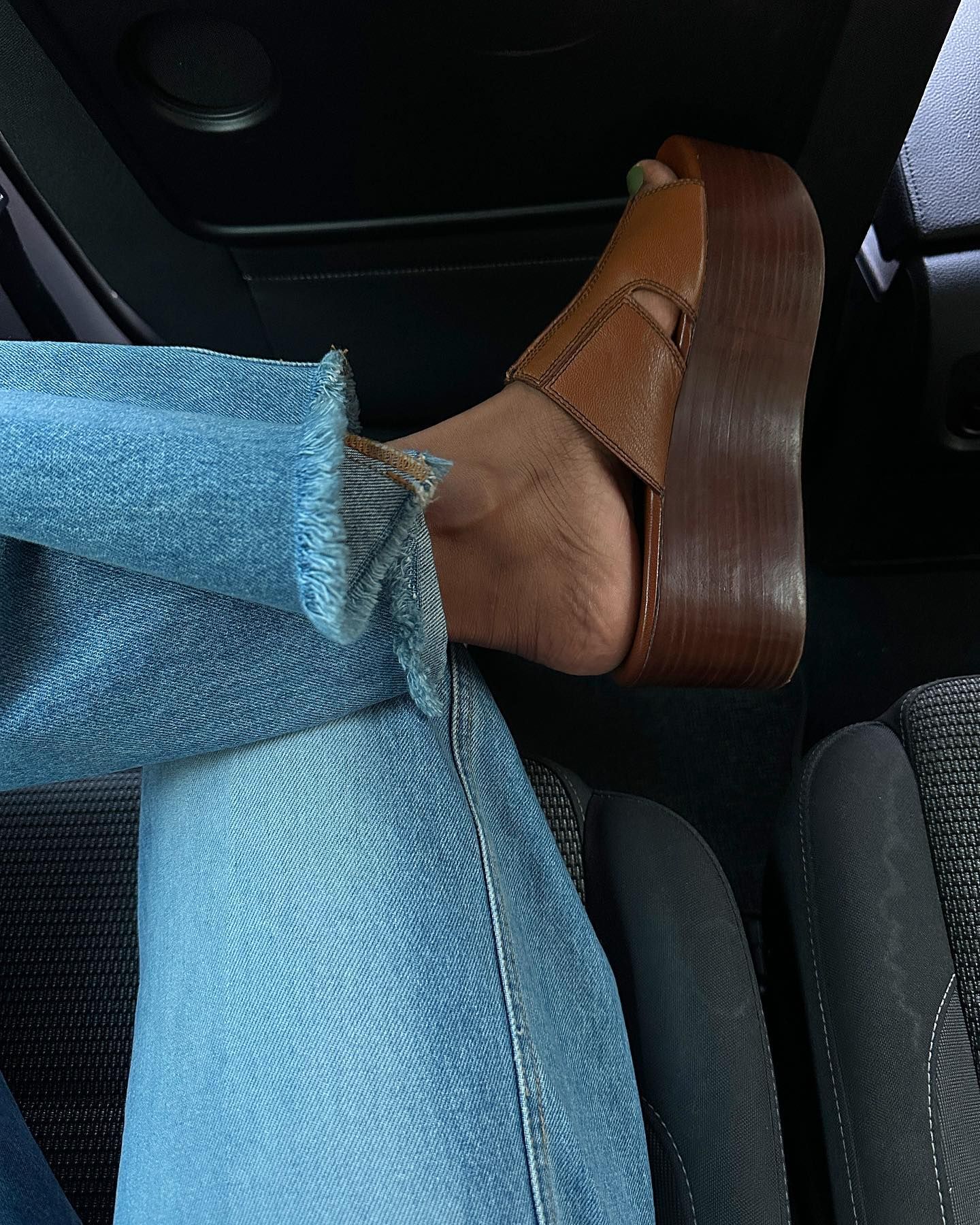 Influencer wears a chunky wedge.
