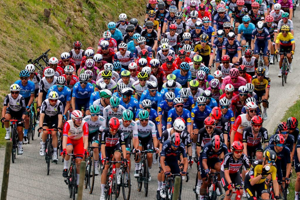 The pack rides during the second stage of the Giro dItalia 2021 cycling race 179 km between Stupinigi and Novara Piedmont on May 9 2021 Photo by Luca Bettini AFP Photo by LUCA BETTINIAFP via Getty Images