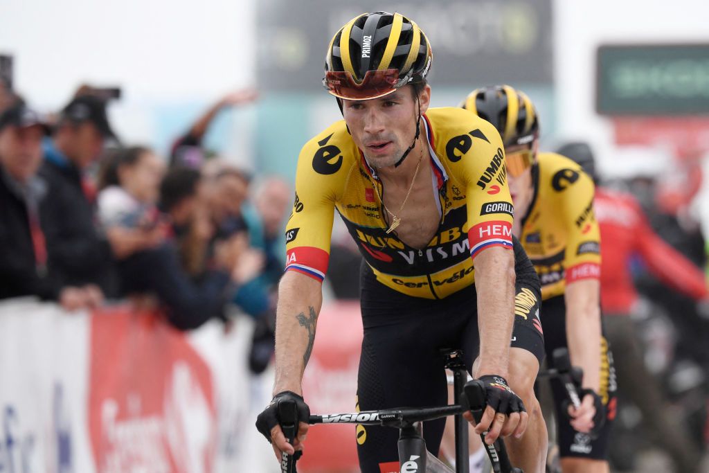 TOPSHOT Team Jumbos Slovenian rider Primoz Roglic crosses the finish line in first place followed by Team JumboVismas Danish rider Jonas Vingegaard during the stage 17 of the 2023 La Vuelta cycling tour of Spain a 1244 km race between Ribadesella and Alto de lAngliru on September 13 2023 Photo by MIGUEL RIOPA AFP Photo by MIGUEL RIOPAAFP via Getty Images