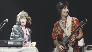Mick Jagger (on left) and Ronnie Wood of English rock group the Rolling Stones perform live on stage in the United States on one date of The Rolling Stones Tour of the Americas '75, in June 1975.
