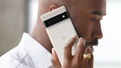 Google Pixel 6 smartphone being used by adult human male