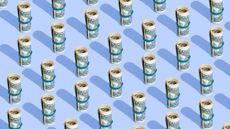 Repeated rolls of American dollars on a blue background